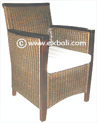 Rattan chair with wooden arms